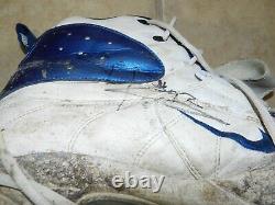 Shaun Rogers Autographed Game Used Cleats Detroit Lions